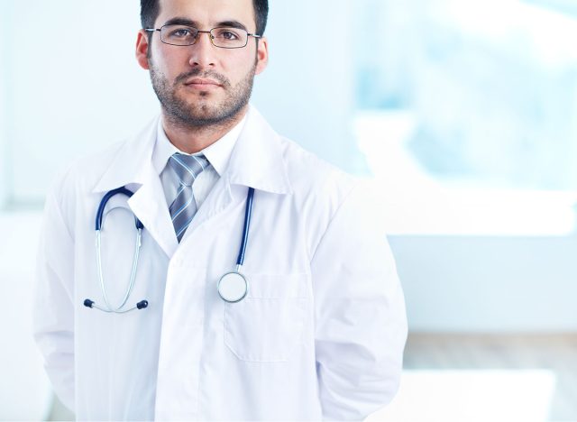 Portrait of serious doctor with stethoscope looking at camera