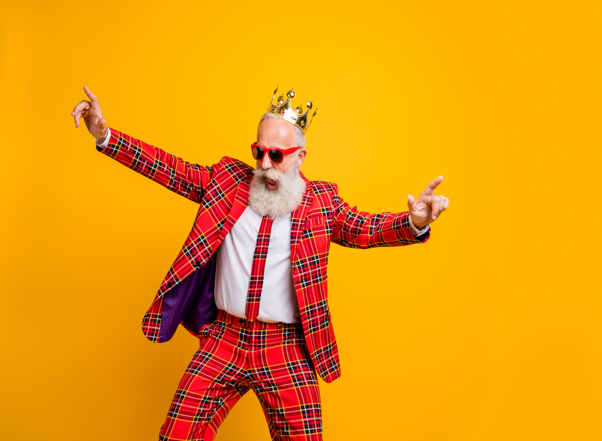 Old man dancing with a crown