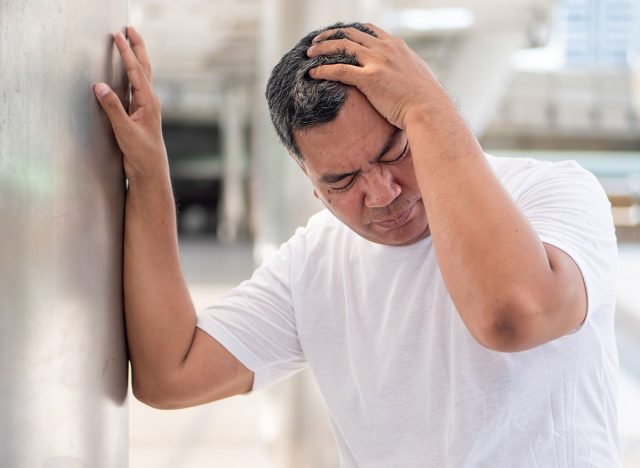 man having headache after drinking too much water