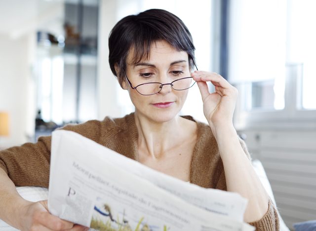 mature woman reading, leading an incredibly healthy life