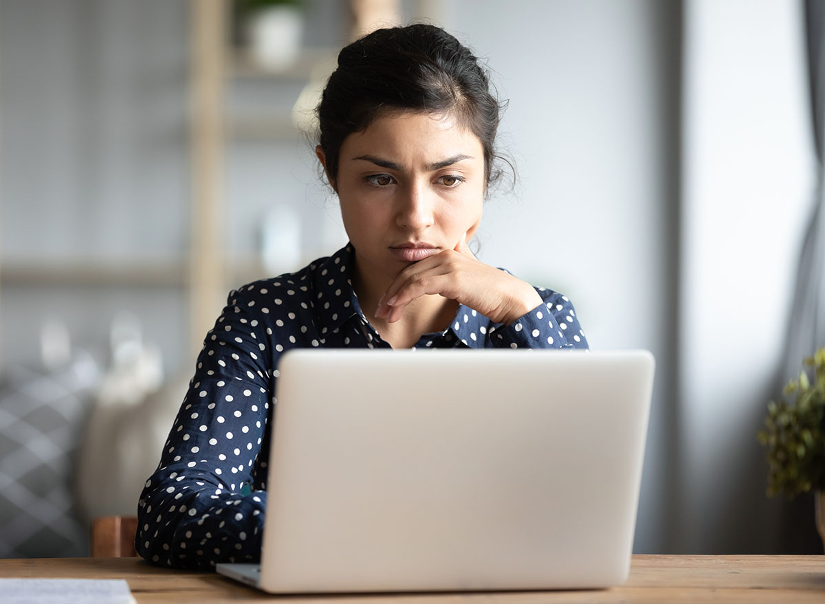 Serious,Frowning,Indian,Ethnicity,Woman,Sit,At,Workplace,Desk,Looks,worry