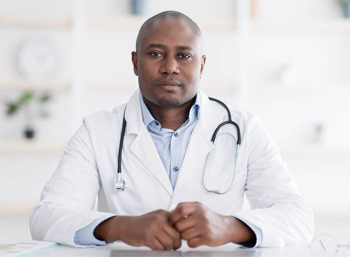 Portrait,Of,Confident,African,American,Doctor,In,White,Uniform,Looking