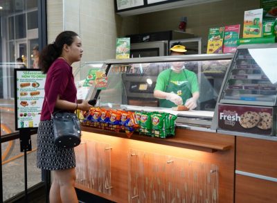 subway employee welcoming customer