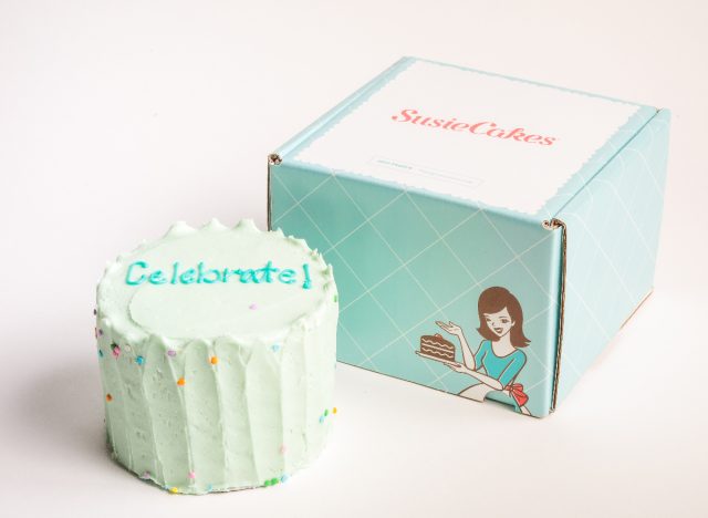 SusieCakes retro blue frosted celebration cake next to box