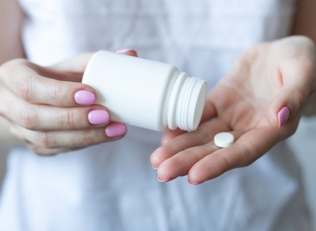 closeup woman taking melatonin