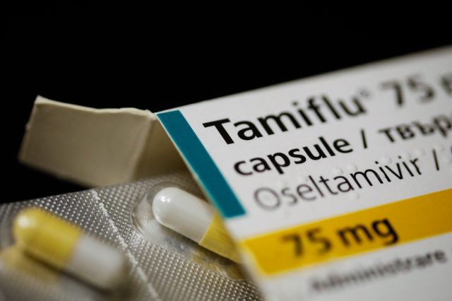 Close up image with a Tamiflu capsule (oseltamivir) on a blister pack, an antiviral medication.