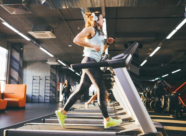 woman performing treadmill workout in gym to lose unwanted weight