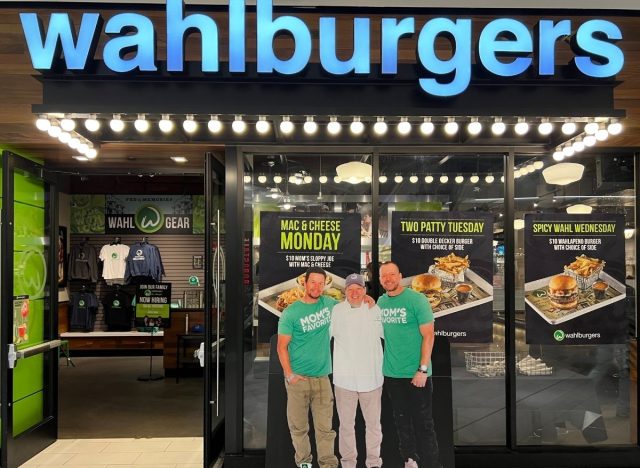Donnie, Mark, and Paul Wahlberg in front of Wahlburgers restaurant 