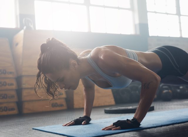 woman performing hand release pushup