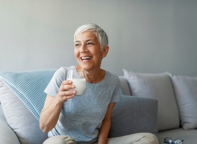 woman holding glass of milk