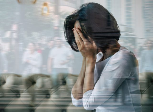 woman having panic attack indoors