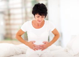 mature woman dealing with pelvic pain from recurring UTIs