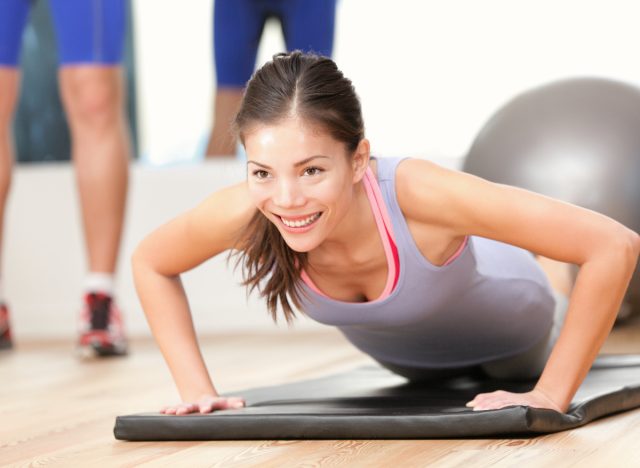 woman performing pushups during couples workout