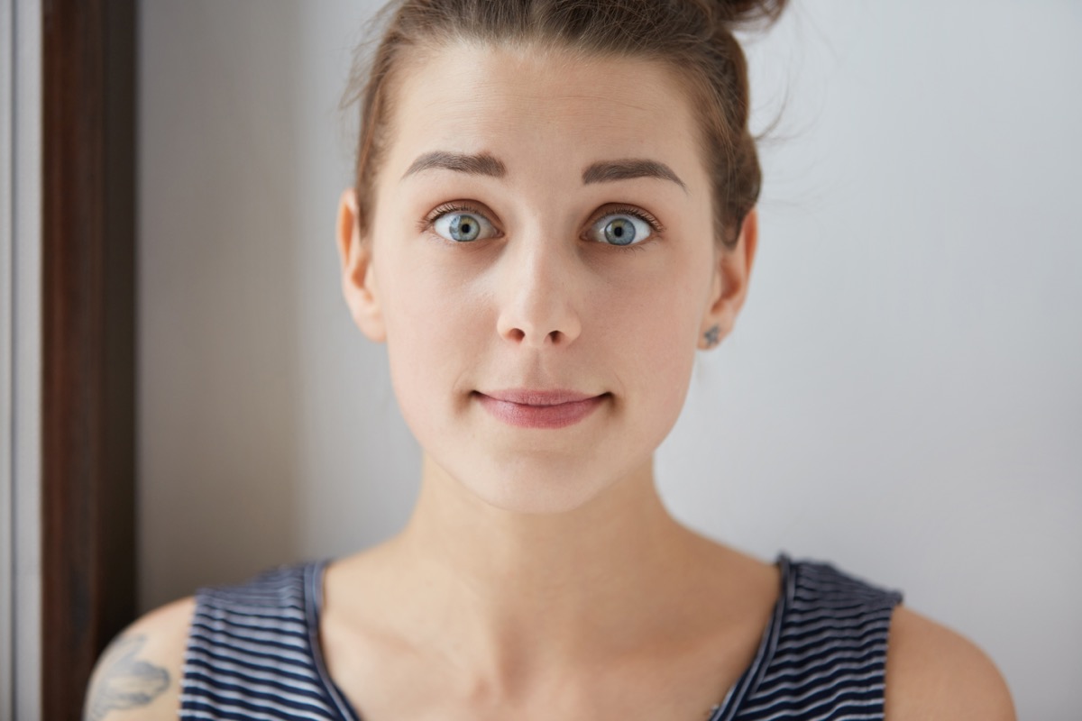Stylish,Shot,Of,Surprised,Scared,Caucasian,Girl,With,Brown,Hair,