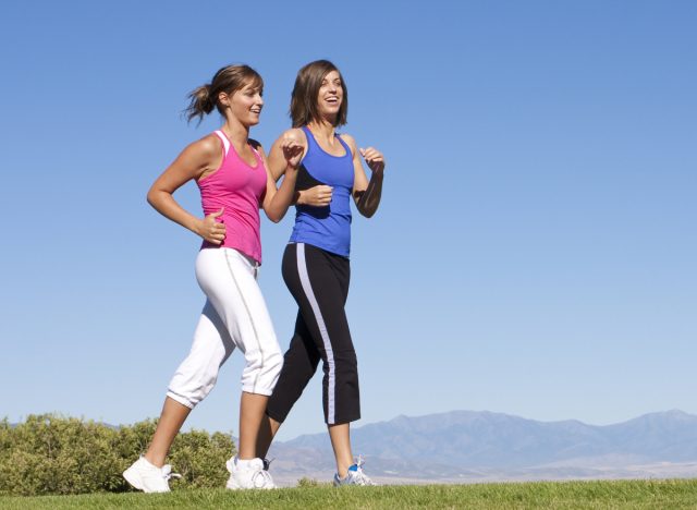 women walking outside to address their step debt