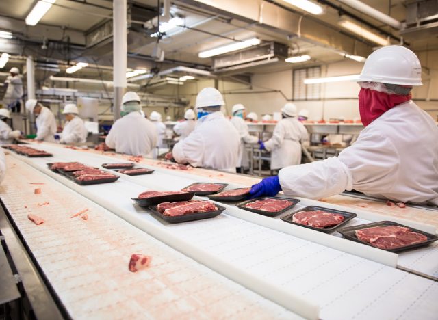 workers packing meat