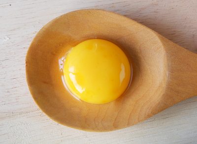 Egg Yolk on wooden spoon