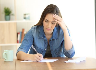 Woman Stressed from Writing