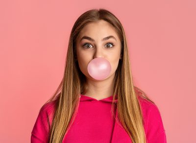 Woman Blowing Bubble with Gum