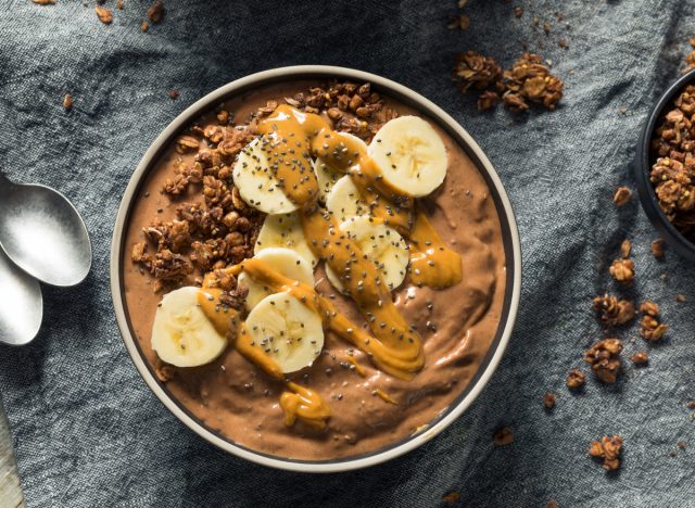 chocolate smoothie bowl with banana, peanut butter, and granola