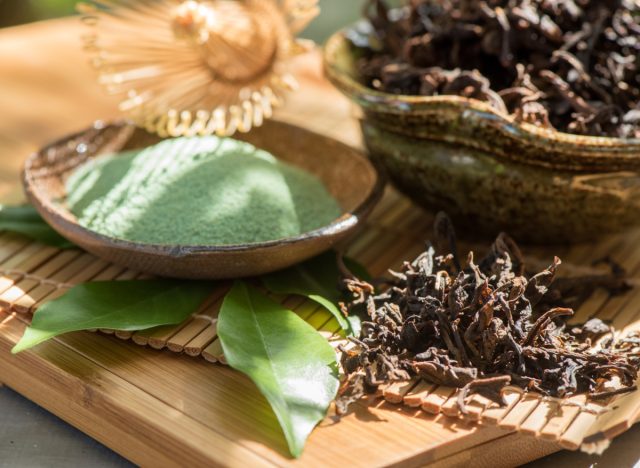 dried green tea leaves and powder