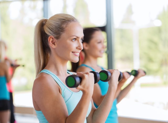 women performing dumbbell bicep curls