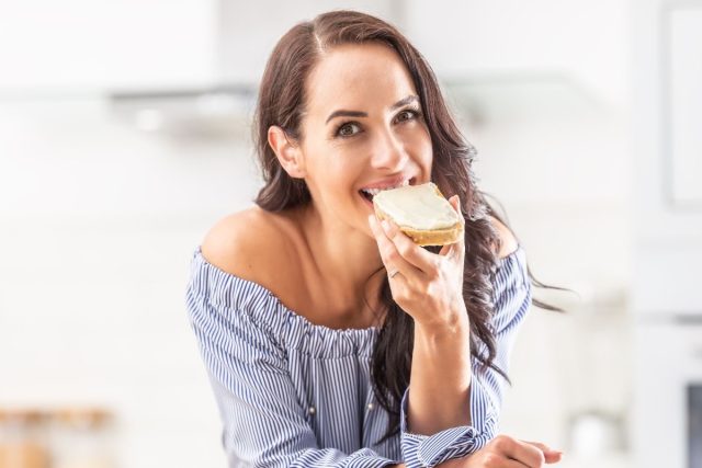 eating slice of bread