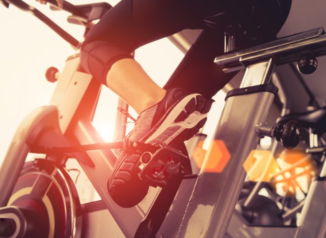 woman working out on exercise bike