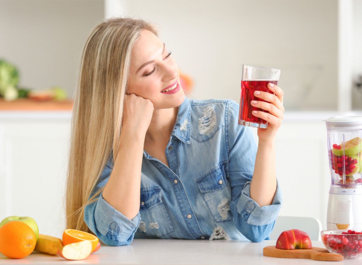 Girl holding cran juice