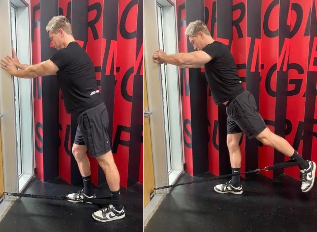 trainer performing resistance training exercises for seniors on door mount