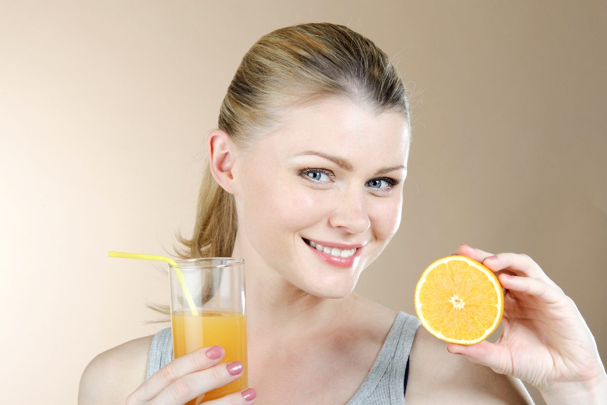 woman healthy skin, orange juice