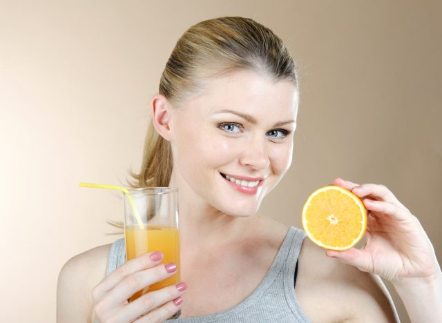 woman healthy skin, orange juice