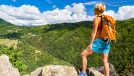 woman hiking outdoors, exercise to lose inches off your waist