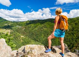 woman hiking outdoors, exercise to lose inches off your waist