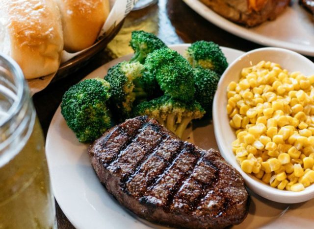 logan's roadhouse steak, broccoli, corn, and rolls