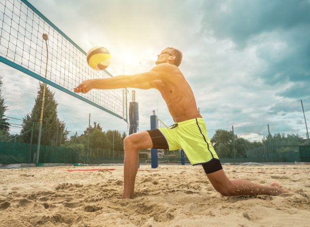man playing beach volleyball, workouts that don't feel like work