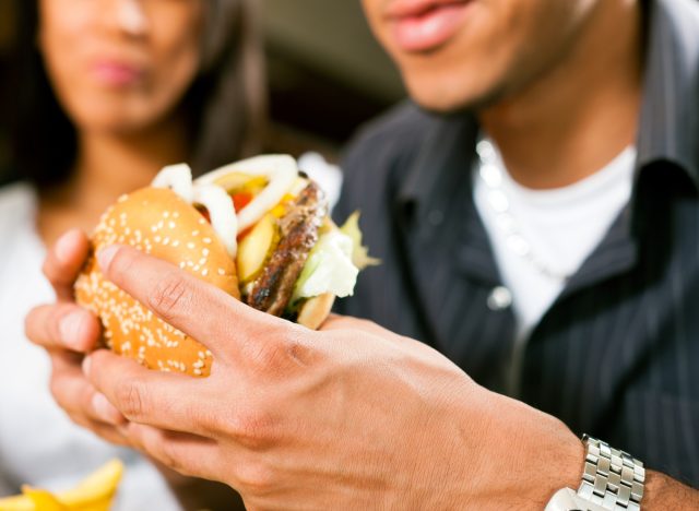 man holding burger