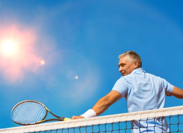 man playing tennis exercise to prevent osteoporosis