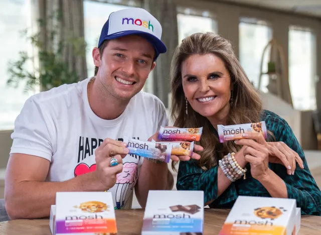 maria shriver and patrick shwarzenegger holding mosh bars