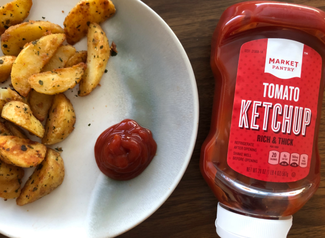 market pantry ketchup bottle and fries and ketchup on plate. 