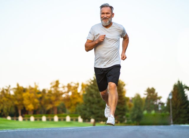 running mature man showing signs of poor fitness as you age