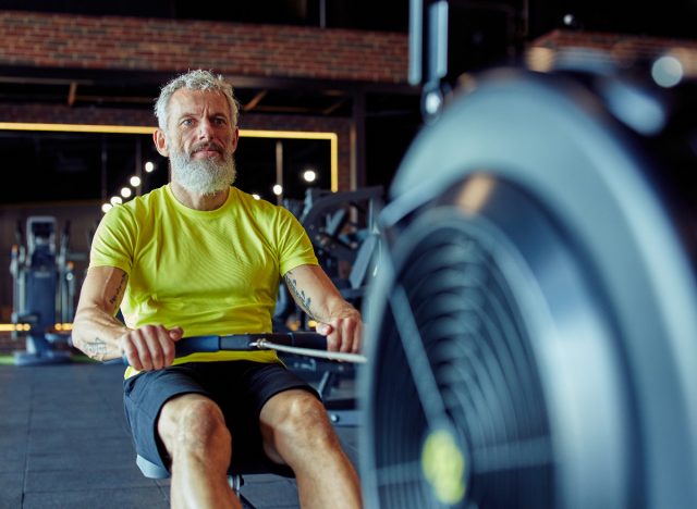 senior man doing rowing workouts for weight loss