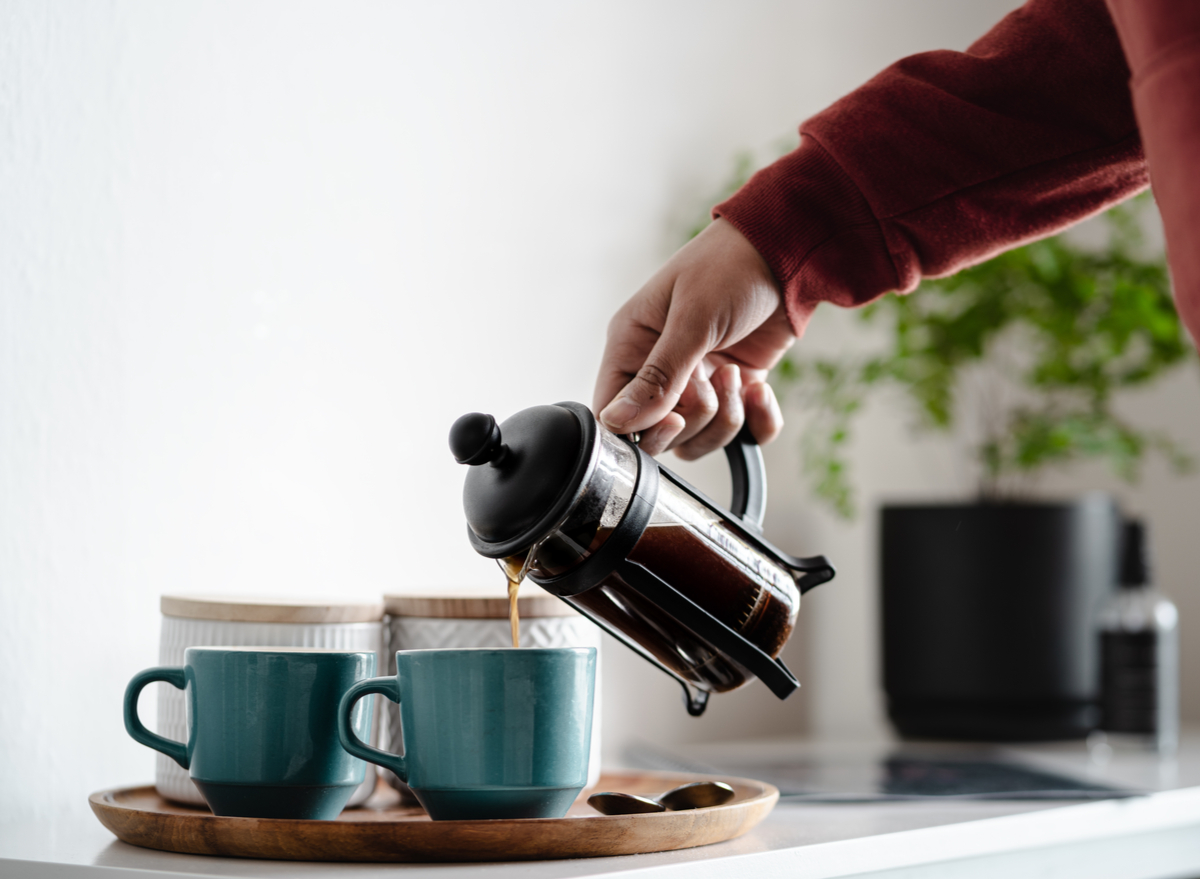 pouring coffee into two cups