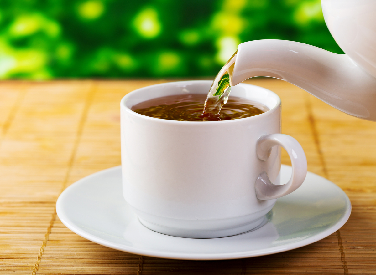 pouring tea into cup