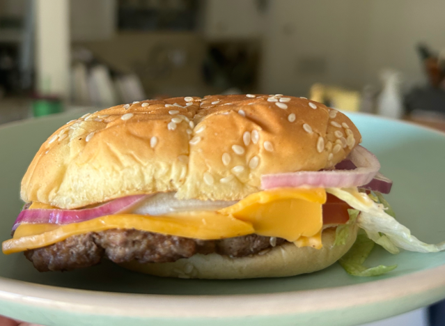 rally's cheeseburger on a plate. 
