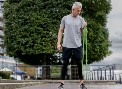 man doing resistance band exercise