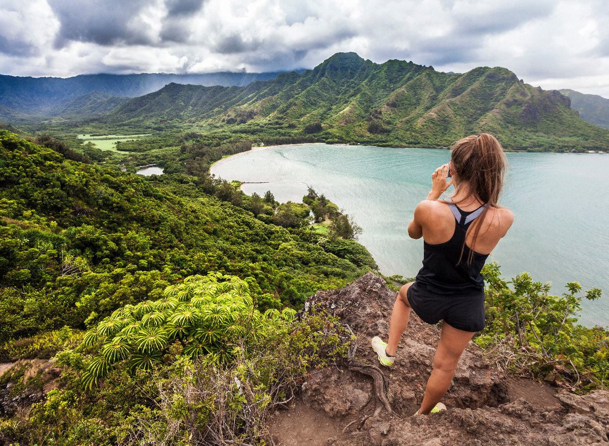 woman on top of scenic hike in hawaii, way to get toned without exercising