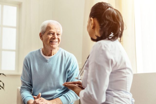 senior man consulting with doctor