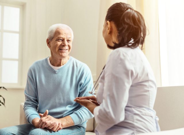 senior man consulting with doctor