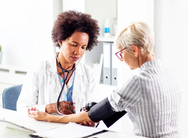 woman taking blood pressure, predicting how long you'll live